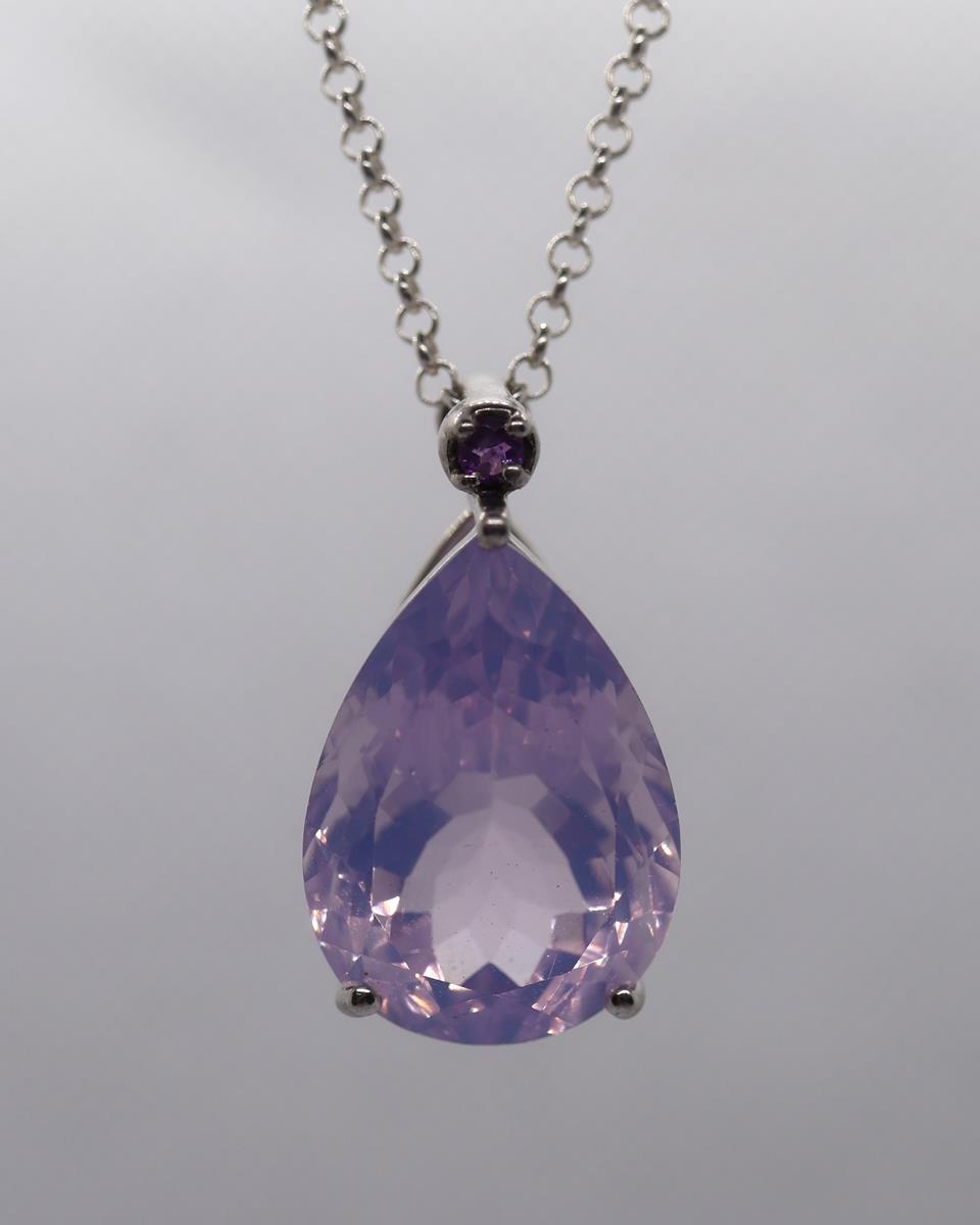 Silver and amethyst pendant on chain