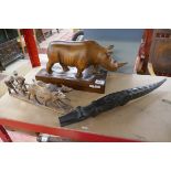 3 wooden carvings to include a rhinoceros