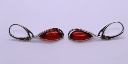 Pair of silver amber set earrings