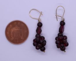 Pair of 9ct gold garnet drop earrings