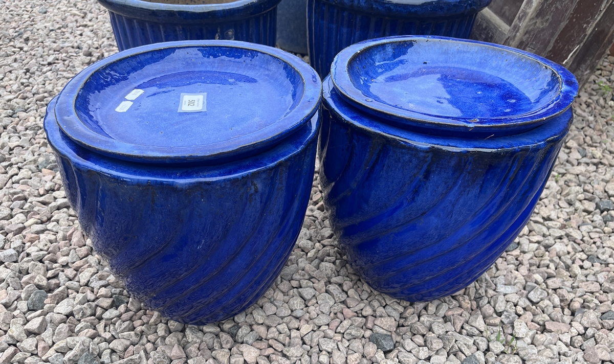 Pair of cobalt blue glazed plant pots with saucers