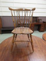 A 20th century oak stick back dining chair