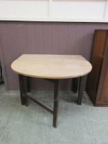 A 20th century gate leg kitchen table