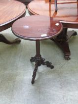 A Victorian mahogany side table, the top over cylindrical tapering column on three ornately carved