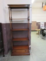 A 20th century four tier whatnot with single drawer to base Front left pillar loose from top,