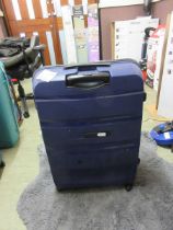 +VAT A blue American Tourister large suitcase
