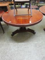 A 19th century mahogany breakfast table, the top over tapering cylindrical column on triform base