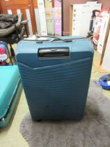 +VAT A blue American Tourister large suitcase