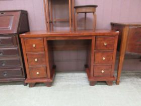 A 20th century oak twin pedestal desk, the top over three-drawer pedestals