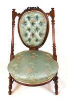 A Victorian walnut salon chair, with button panel back with horsehair filling flanked by turned