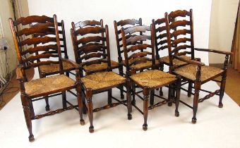 A set of eight Titchmarsh & Goodwin ladderback dining chairs, with rush seats and turned front