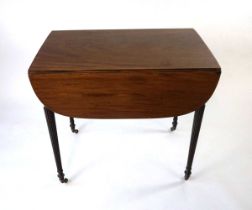 A George III mahogany Pembroke table, the drop leaves with rounded corners and lip moulded edge,