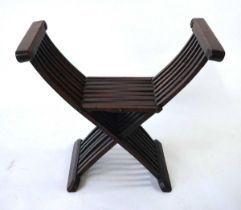 A 19th century Savonarola style backless folding chair, the armrests terminating with shallow