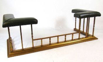 A good Victorian style brass club fender, with green leather padded corner seats with strip stud