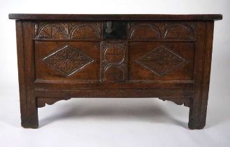 A late 17th/early 18th century oak coffer, the top with three recessed panels and split pin