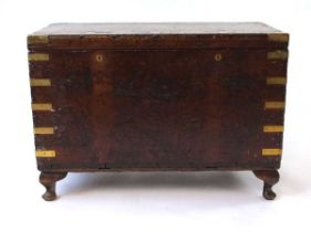 An 18th century mahogany sea captain's chest, with brass bindings and sunken carrying handles, and