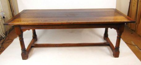 A Titchmarsh & Goodwin oak refectory table, the plank top with cleated ends, on turned legs united