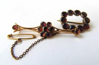 A Georgian yellow metal and almandine garnet buckle brooch together with one similar brooch. Approx.