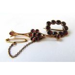 A Georgian yellow metal and almandine garnet buckle brooch together with one similar brooch. Approx.