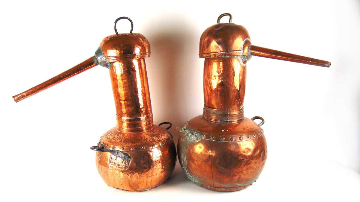 Two large copper pot bellied alcohol stills, each with planished decoration, with either brass or - Image 2 of 2