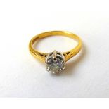 An 18ct gold diamond solitaire ring, the round brilliant stone approximately 0.45ct. Size H 1/2.