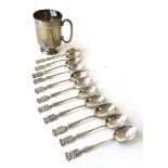 A George V silver christening mug together with a set of white metal souvenir spoons. Approx. weight