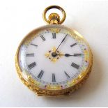 A late 19th/early 20th century yellow metal fob watch marked '18K', the enamelled dial with red