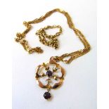 An Edwardian yellow metal and amethyst pendant marked '9ct' together with two 9ct gold chains.