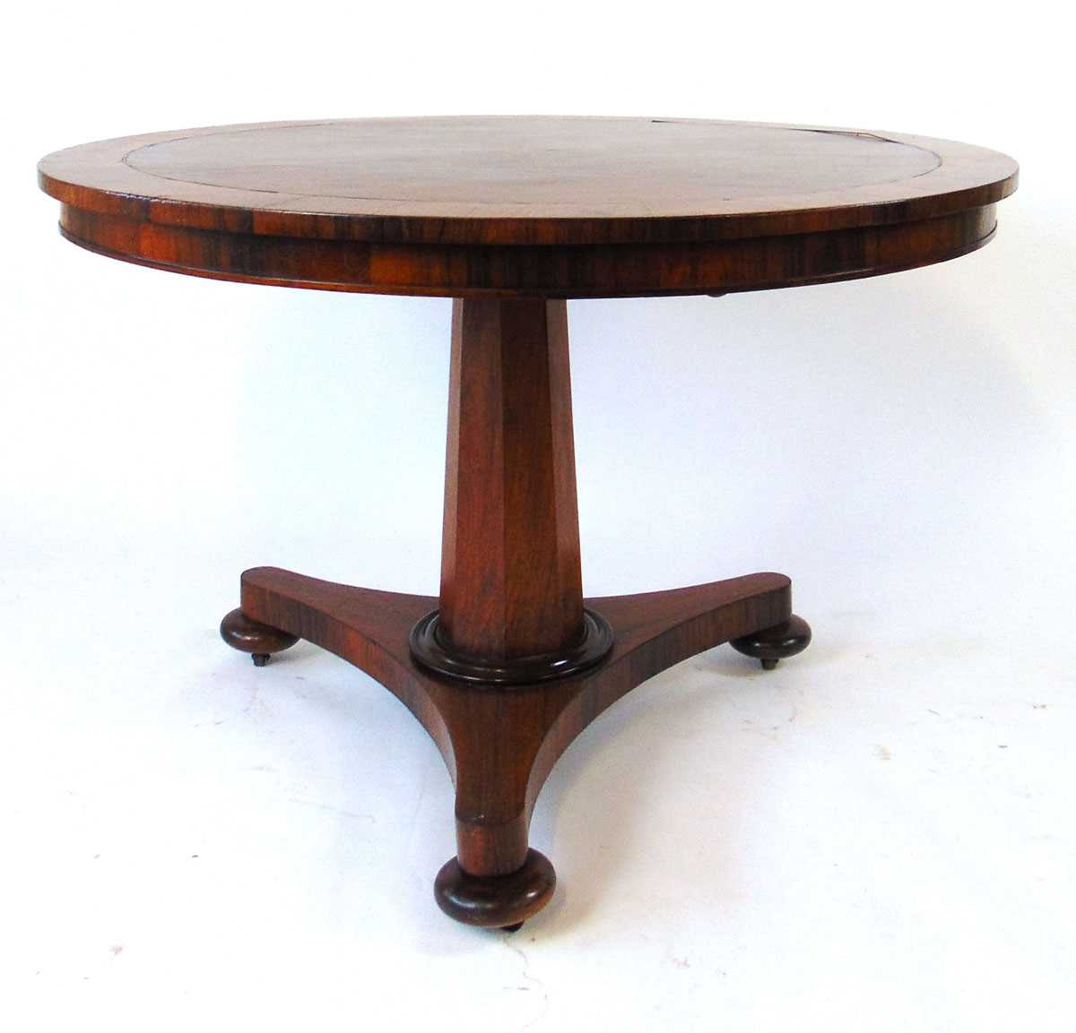 A 19th century rosewood tilt top table, with crossbanded edge and brass stringing, on an octagonal - Image 4 of 4