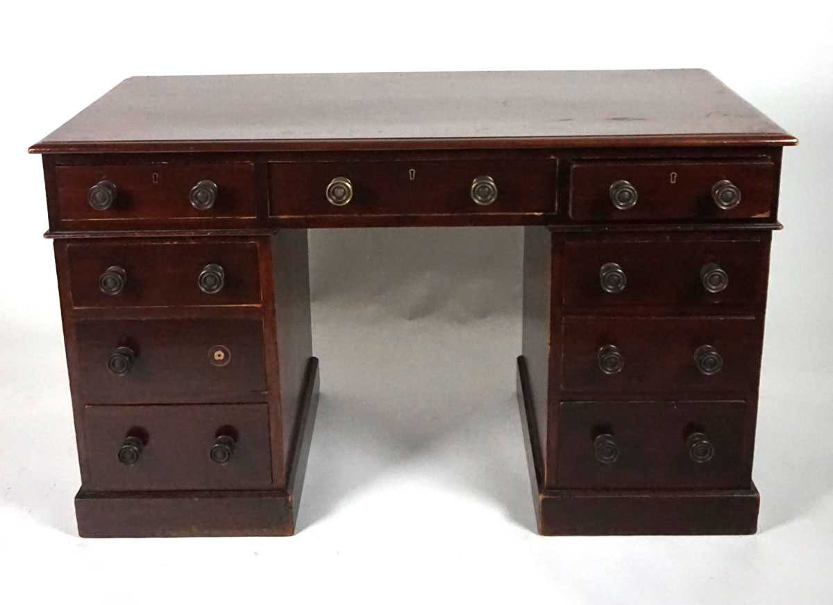 A 19th century mahogany twin pedestal desk, stamped for Heal & Son, London, with three frieze