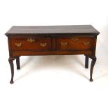 An 18th century oak and mahogany crossbanded dresser, the two plank top with moulded edge above