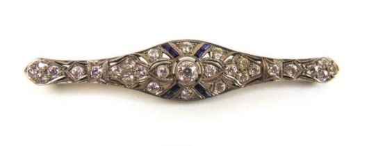 An early 20th century diamond and sapphire bar brooch. Total diamond weight estimated in excess of