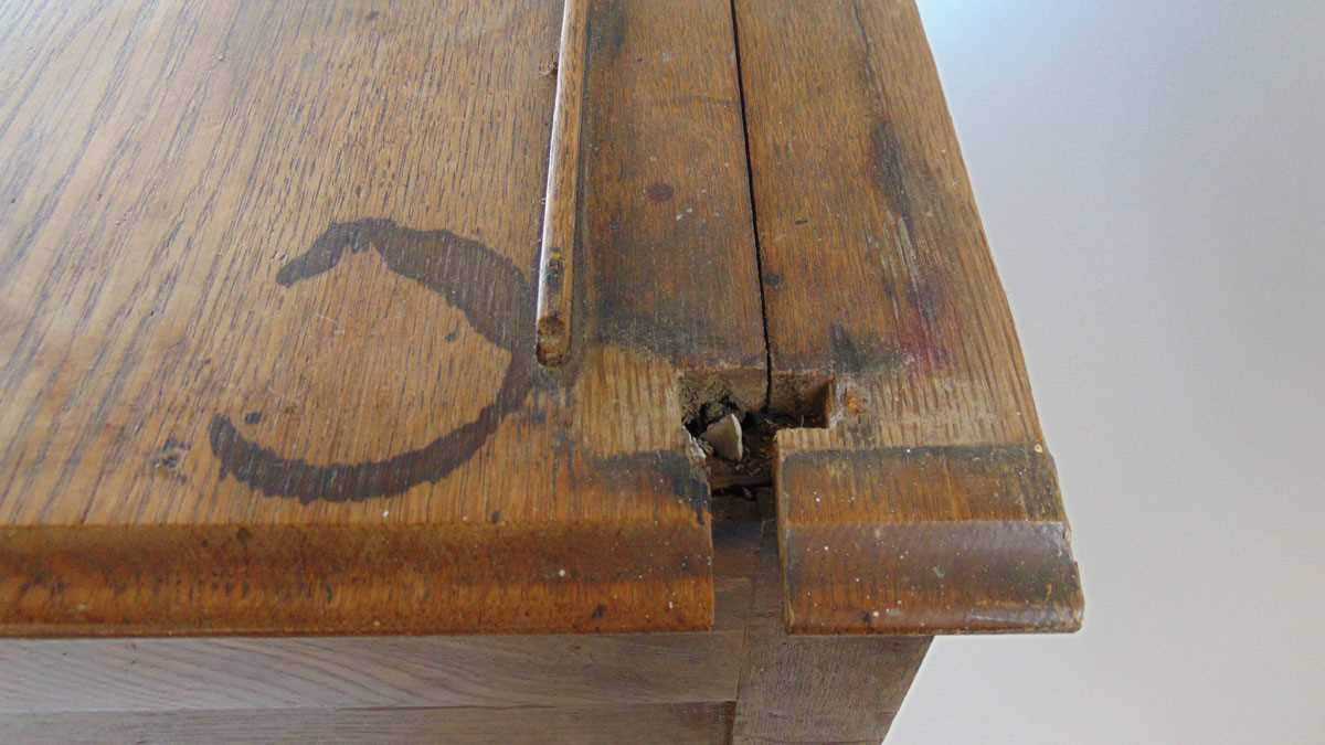 An 18th century oak dresser, with moulded pediment over three shelves and iron hooks, the base - Image 7 of 9