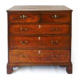 A mid 18th century oak chest of drawers, with crossbanded decoration and later bone escutcheons,