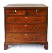 A mid 18th century oak chest of drawers, with crossbanded decoration and later bone escutcheons,