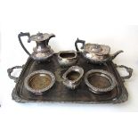 A Walker & hall silver plated five piece tea set, all but the tray engraved with monogram; and a