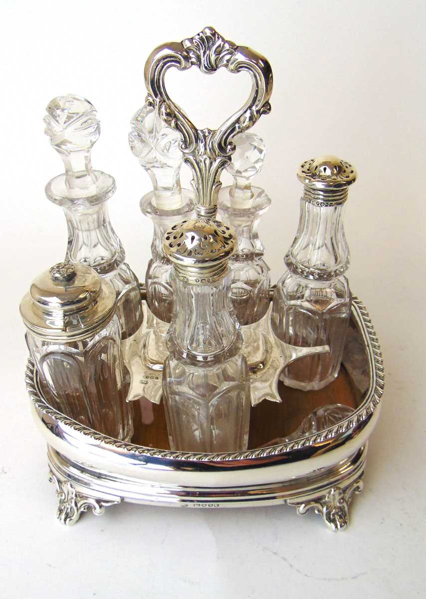 A Victorian silver seven bottle cruet stand, John Evans II, London 1846, with gadrooned rim on C - Image 2 of 2