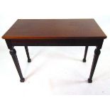 An Edwardian classical revival mahogany side table, of rectangular form, on square fluted legs on