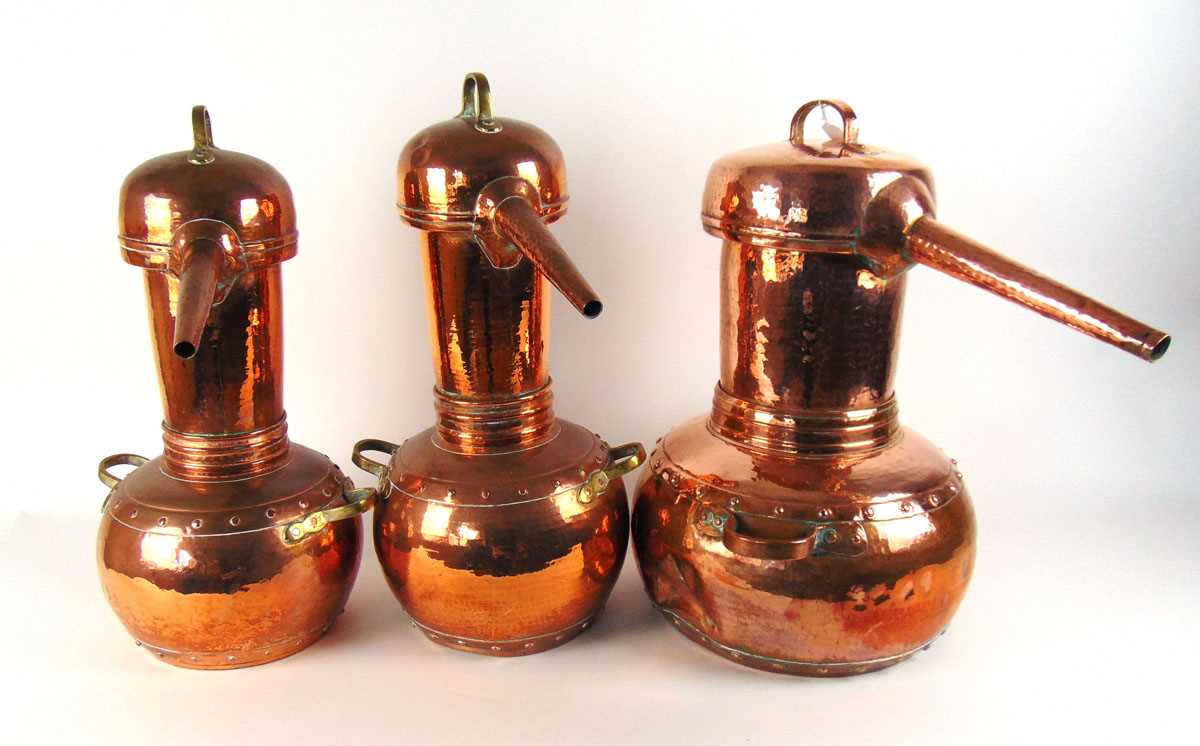 Three copper pot bellied alcohol stills, each with planished decoration, with either brass or copper - Image 2 of 2