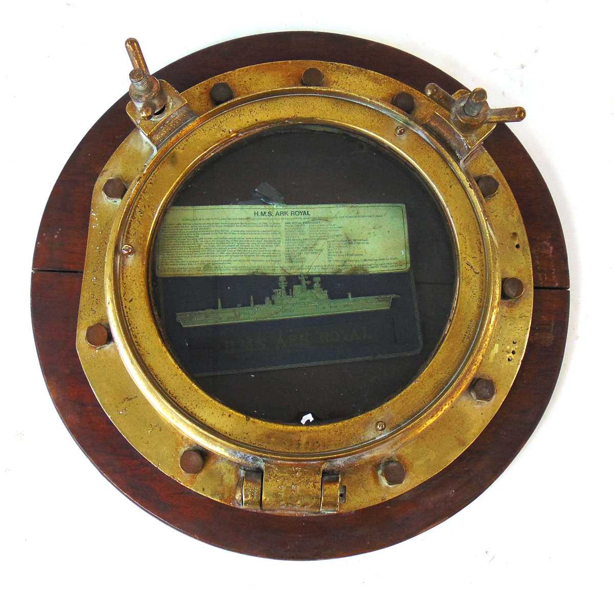 A solid brass Port Hole of HMS Ark Royal (1955-1978), stamped John Roby Ltd, Rainhill, the hinge