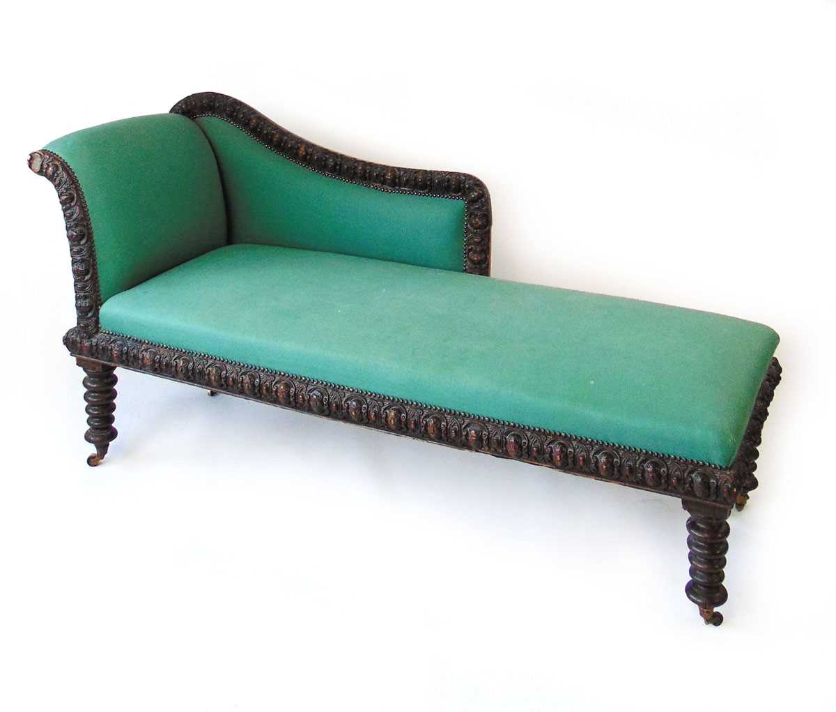 A 19th century oak chaise longue, the frame with a continuous band of oval foliate carved bosses, - Image 2 of 4