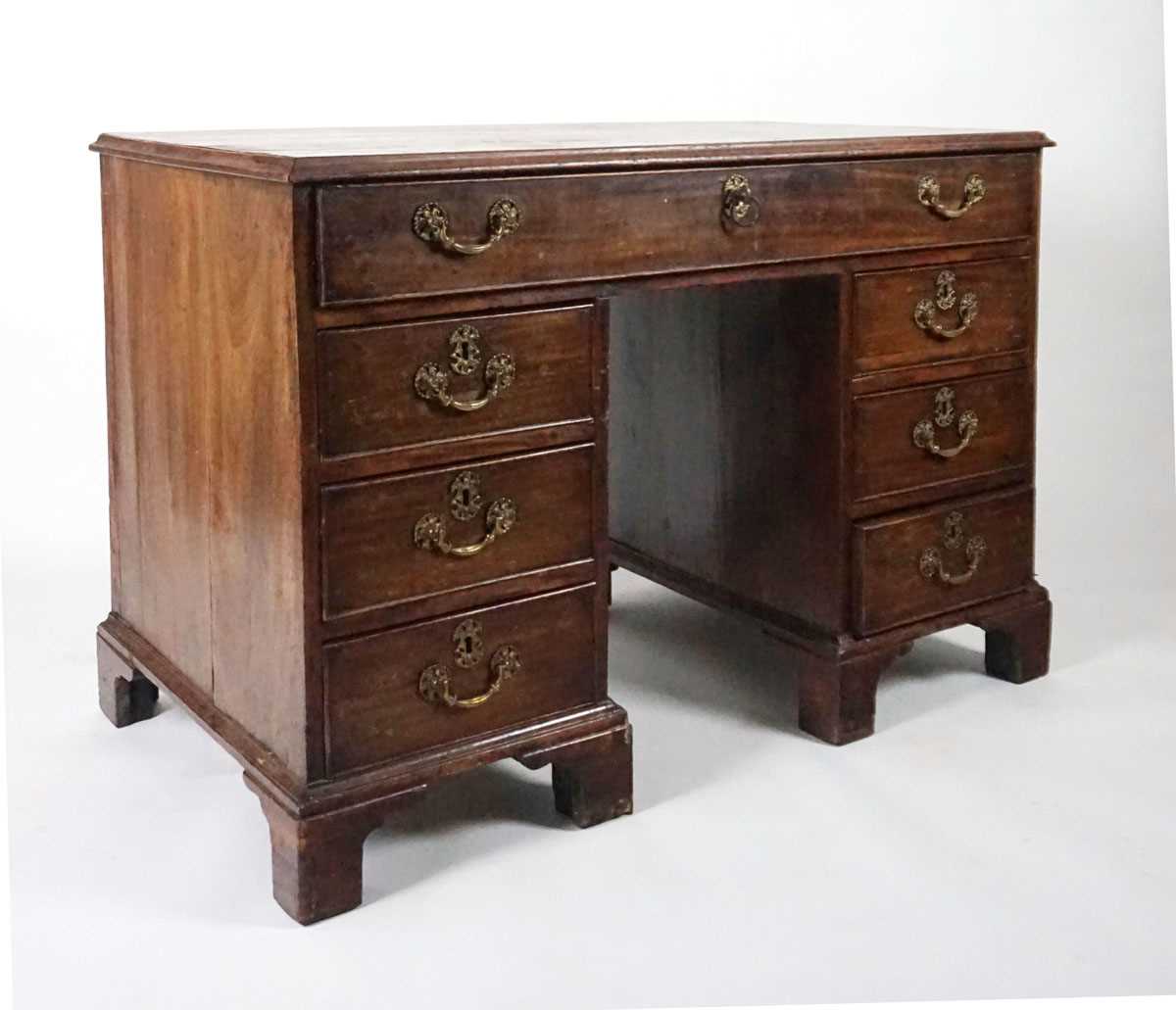 A George III mahogany desk, the top with applied moulded edge, above a long drawer fitted with a - Image 5 of 17