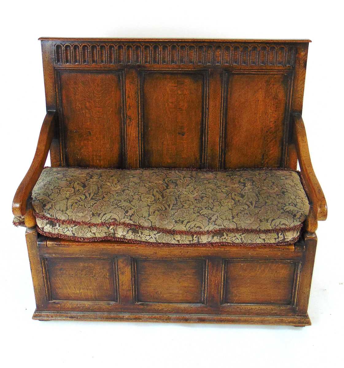 An early 20th century reproduction oak box settle, with a narrow arcaded frieze above three - Image 2 of 7
