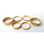 A 22ct gold wedding band together with five 9ct gold examples. Approx. weights 1.9g & 9.6g A/F