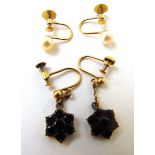 A pair of early 20th century, yellow metal and garnet drop earrings together with a pair of yellow