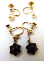 A pair of early 20th century, yellow metal and garnet drop earrings together with a pair of yellow