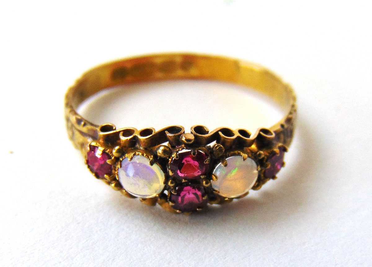 A mid-Victorian 15ct gold, garnet and moonstone ring with engraved shank. Size N. Approx. weight 1. - Image 2 of 2