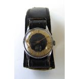 A Smiths De Luxe mechanical wristwatch on trench style strap. Not currently working