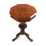 A Victorian trumpet form walnut veneered and inlaid sewing table, the octagonal top with checker