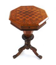 A Victorian trumpet form walnut veneered and inlaid sewing table, the octagonal top with checker